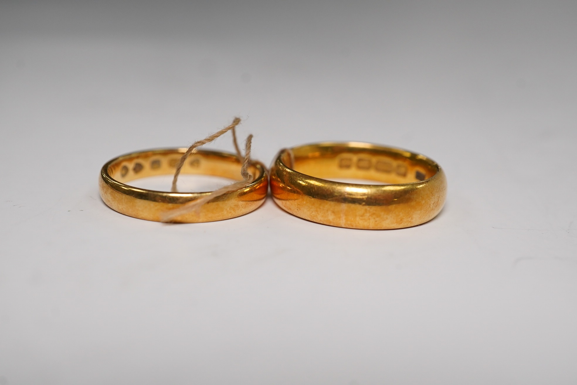 Two 22ct gold wedding bands, K/L & L, 10.3 grams. Condition - fair
